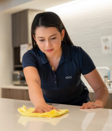 woman cleaning break room 